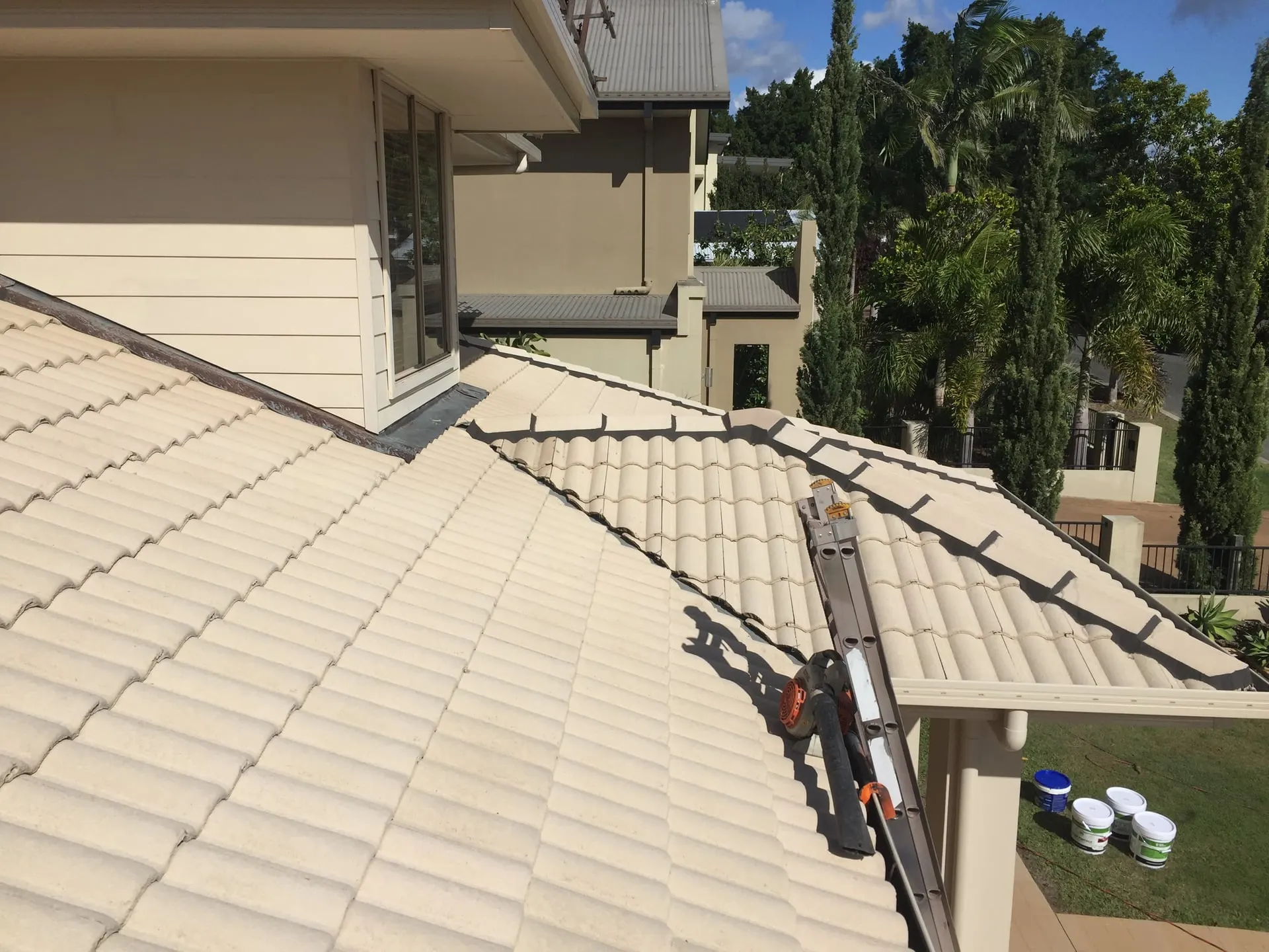 Pale cream tiled roof after restoration